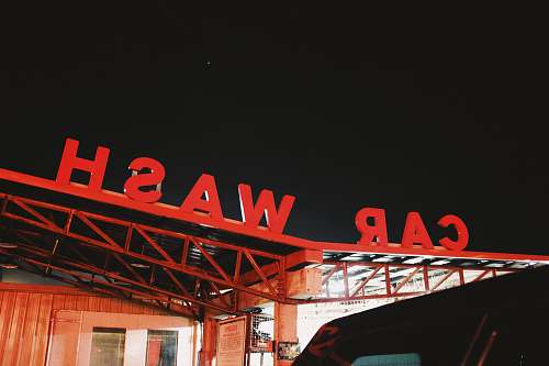 car wash red Car Wash cutout signage on top of roof sign